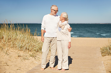 Image showing happy senior couple talking outdoors