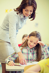 Image showing group of school kids writing test in classroom