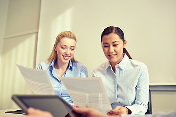 Image showing smiling businesswomen meeting in office