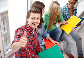 Image showing group of happy students showing thumbs up