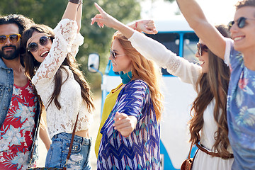 Image showing happy young hippie friends dancing outdoors