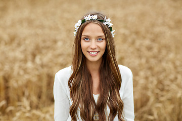 Image showing smiling young hippie woman on cereal field