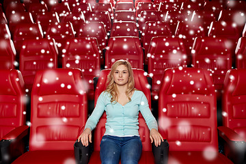 Image showing young woman watching movie in theater