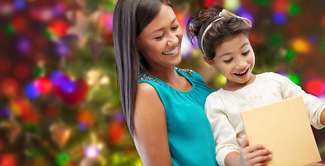 Image showing happy mother and child with gift box