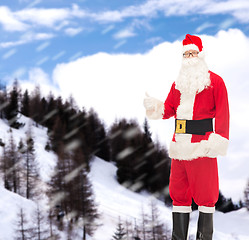 Image showing man in costume of santa claus showing thumbs up