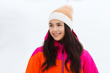 Image showing happy young woman in winter clothes outdoors