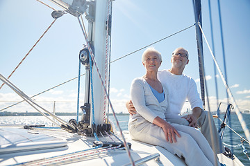 Image showing senior couple hugging on sail boat or yacht in sea