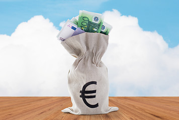 Image showing close up of euro paper money in bag on table