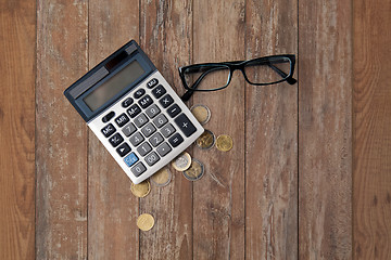 Image showing calculator, eyeglasses and euro coins on table