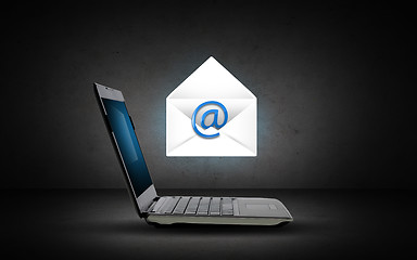 Image showing laptop computer with e-mail icon and letter