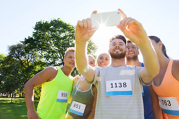Image showing teenage sportsmen taking selfie with smartphone