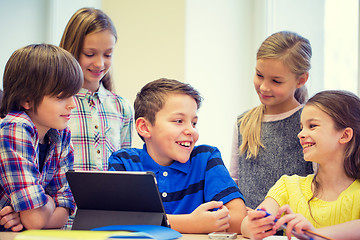 Image showing group of school kids with tablet pc in classroom