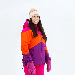 Image showing happy young woman in winter clothes outdoors