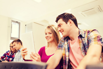 Image showing group of smiling students with tablet pc