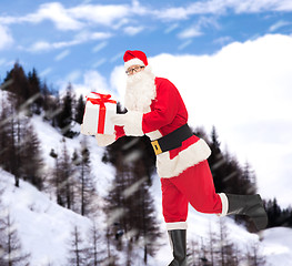 Image showing man in costume of santa claus with gift box