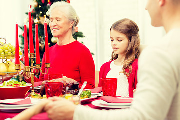 Image showing smiling family having holiday dinner at home