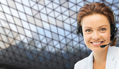 Image showing helpline operator in headset over grid background