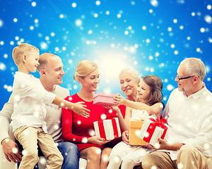 Image showing smiling family with gifts