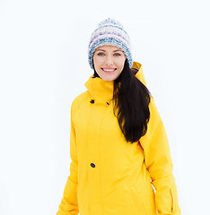 Image showing happy young woman in winter clothes outdoors