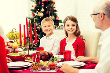 Image showing smiling family having holiday dinner at home