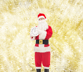 Image showing man in costume of santa claus with clock