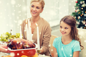 Image showing smiling family having holiday dinner at home