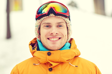 Image showing happy young man in ski goggles outdoors