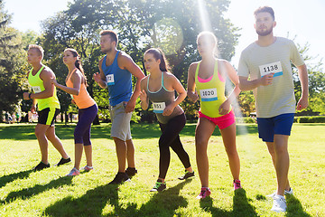 Image showing sportsmen with badge numbers on start of race