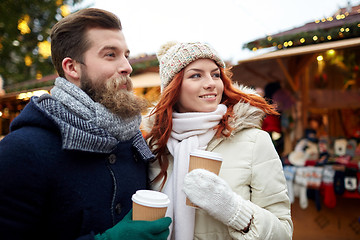 Image showing happy couple drinking coffee on old town street