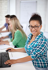 Image showing happy high school students in computer class