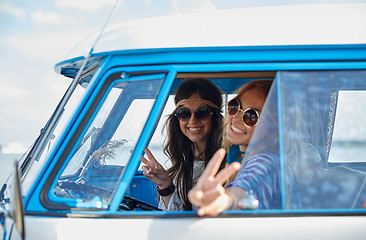 Image showing smiling young hippie women driving minivan car