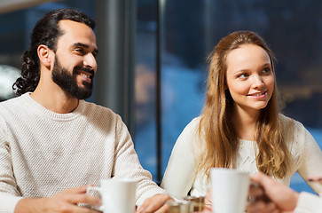 Image showing happy couple meeting and drinking tea or coffee