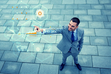 Image showing young smiling businessman outdoors from top