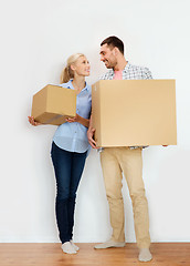 Image showing couple with cardboard boxes moving to new home