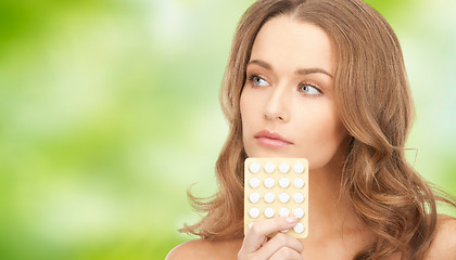 Image showing beautiful young woman with medication