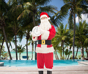 Image showing man in costume of santa claus with clock