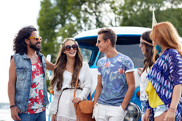 Image showing smiling young hippie friends over minivan car