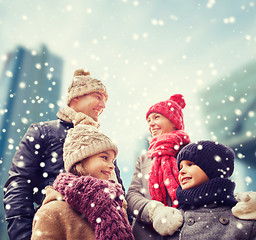 Image showing happy family in winter clothes outdoors