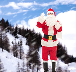 Image showing man in costume of santa claus with bag