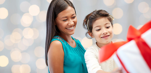 Image showing happy mother and child with gift box