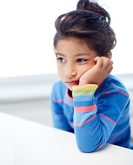 Image showing sad little girl at home or school