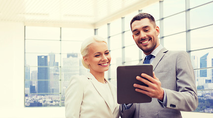 Image showing smiling businessmen with tablet pc outdoors