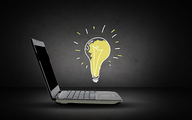 Image showing open laptop computer with lighting bulb doodle