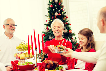 Image showing smiling family having holiday dinner at home