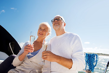 Image showing senior couple with glasses on sail boat or yacht