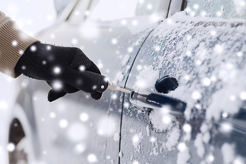 Image showing close up of man with car key outdoors