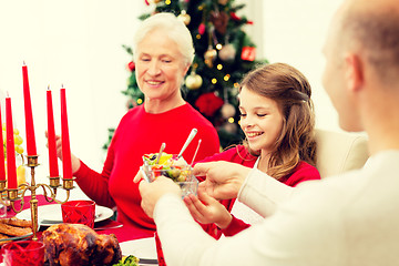 Image showing smiling family having holiday dinner at home