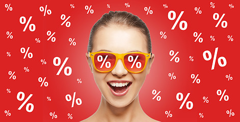 Image showing happy teenage girl in shades with percentage signs