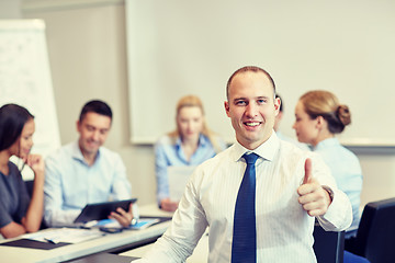 Image showing group of smiling businesspeople meeting in office