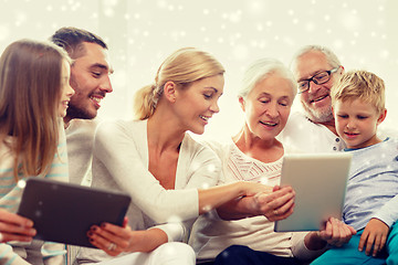 Image showing smiling family with tablet pc computers at home